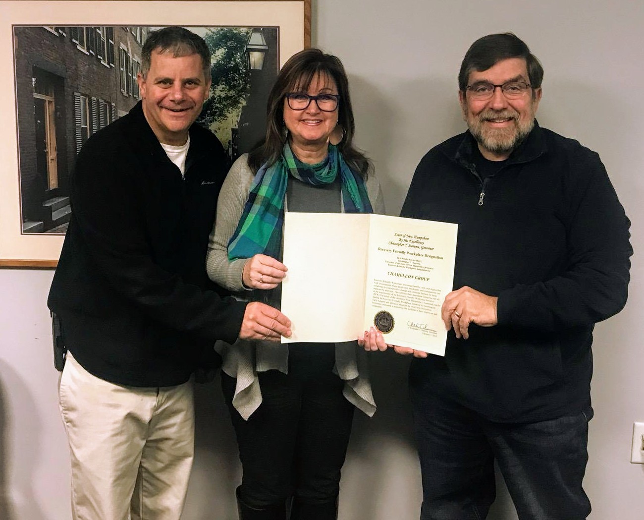 Chameleon Group receiving certificate from Recovery Friendly Advisor